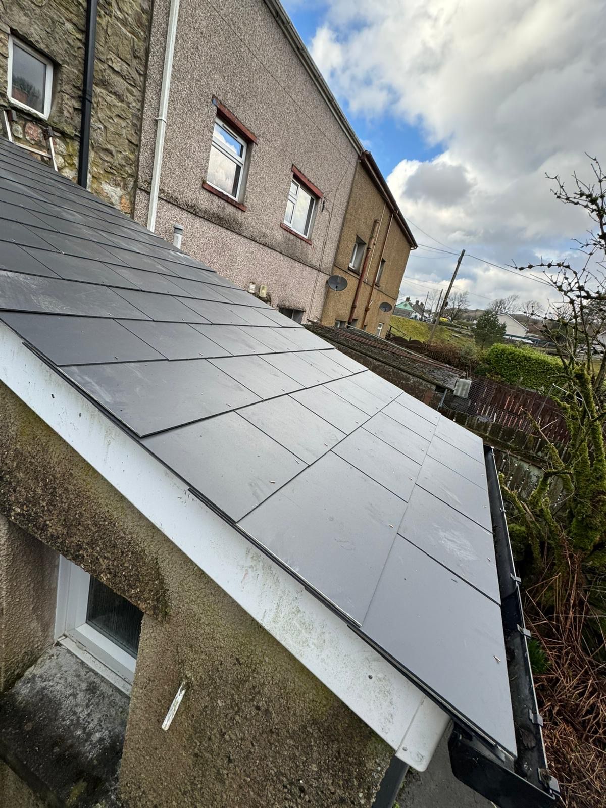 New slate roofing on a lean-to extension in South Wales